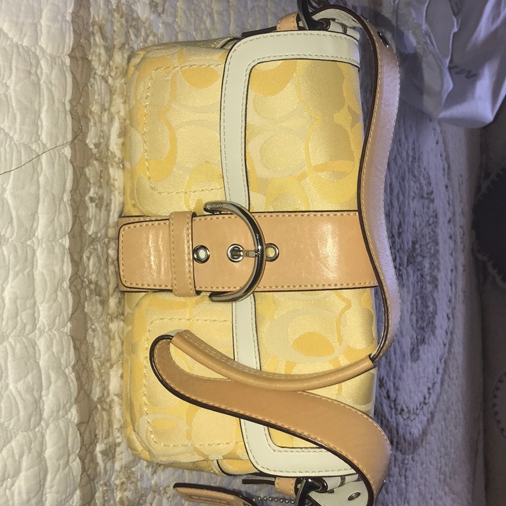 Yellow Coach clutch open to offers
